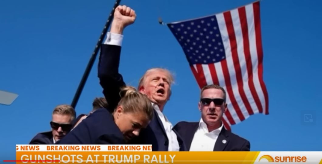 [IMAGE Defiant President Trump Pumps His Fist Just Seconds After Assassination Attempt, July 13, 2024]